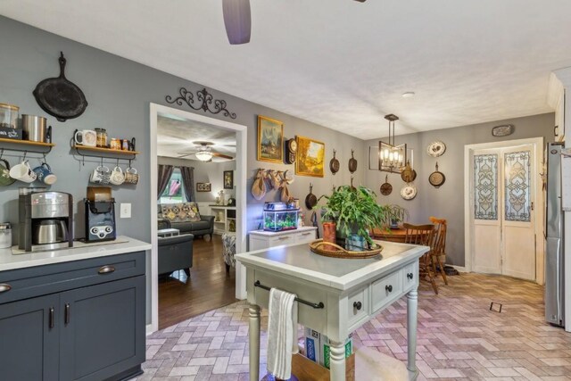 3130 Valley Bend Rd, Murfreesboro, TN 37129 - kitchen featuring a ceiling fan, brick floors, light countertops, decorative light fixtures, and freestanding refrigerator