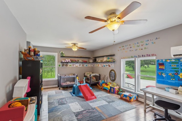 3130 Valley Bend Rd, Murfreesboro, TN 37129 - game room with a wall unit AC, wood finished floors, and a ceiling fan