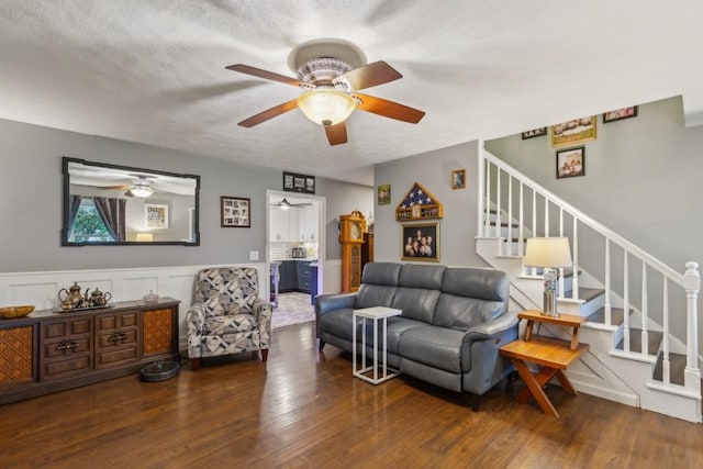 3130 Valley Bend Rd, Murfreesboro, TN 37129 - living area featuring a ceiling fan, stairway, wood finished floors, a decorative wall, and wainscoting