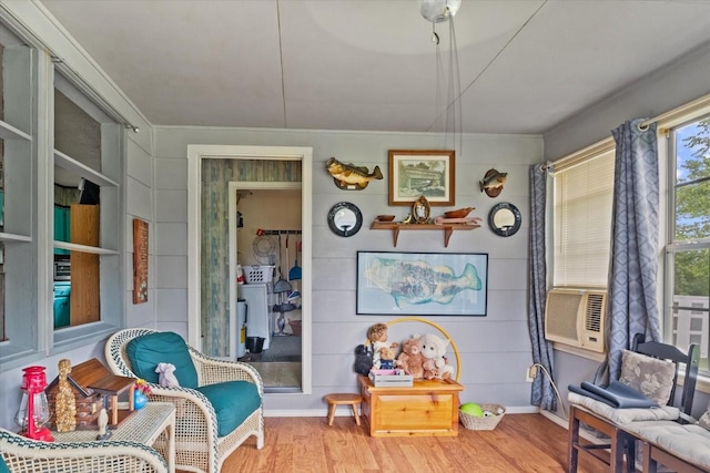 410 Sinking Creek Rd, Petersburg, TN 37144 - living area with wood finished floors, crown molding, cooling unit, and baseboards