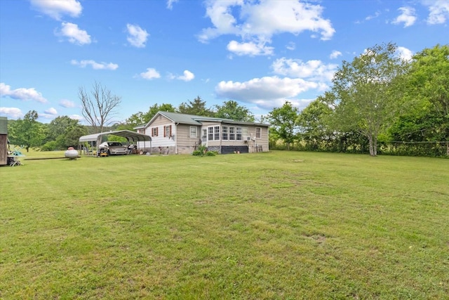 410 Sinking Creek Rd, Petersburg, TN 37144 - view of green lawn featuring a carport