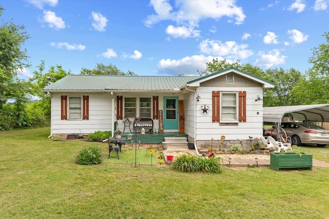 410 Sinking Creek Rd, Petersburg, TN 37144 - view of front of property with a front yard, a carport, a porch, and metal roof