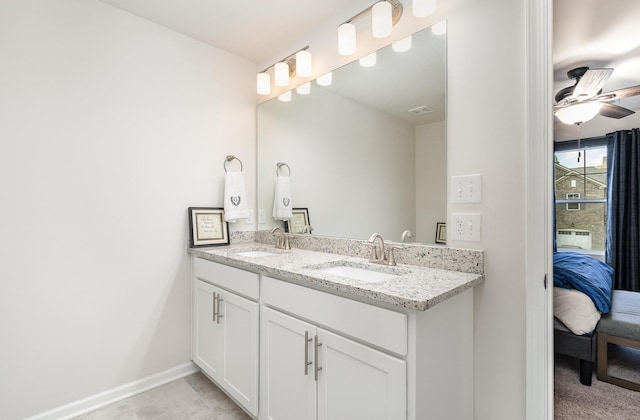 2023 Sperling Dr, Gallatin, TN 37066 - full bathroom featuring double vanity, ensuite bath, baseboards, and ceiling fan