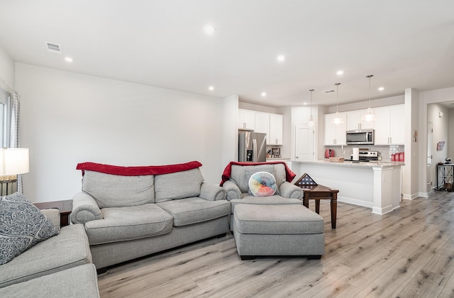 2023 Sperling Dr, Gallatin, TN 37066 - living room featuring recessed lighting, light wood finished floors, and baseboards