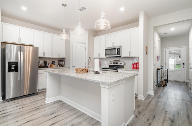 2023 Sperling Dr, Gallatin, TN 37066 - kitchen with appliances with stainless steel finishes, backsplash, light wood-type flooring, white cabinets, and recessed lighting