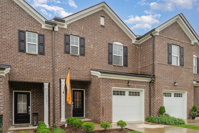 2023 Sperling Dr, Gallatin, TN 37066 - townhome / multi-family property featuring an attached garage, brick siding, and driveway