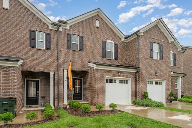 2023 Sperling Dr, Gallatin, TN 37066 - view of front of home with an attached garage, brick siding, and concrete driveway