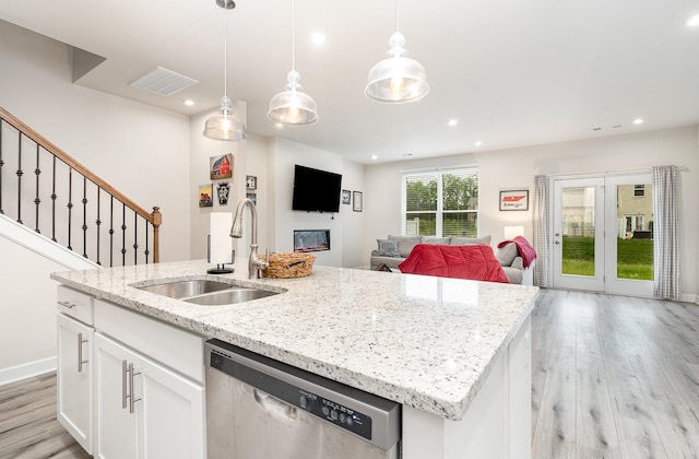 2023 Sperling Dr, Gallatin, TN 37066 - kitchen featuring stainless steel dishwasher, a sink, light wood-style flooring, a kitchen island with sink, and open floor plan