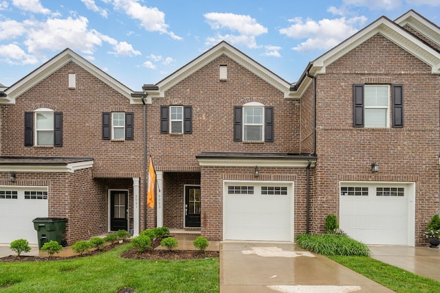 2023 Sperling Dr, Gallatin, TN 37066 - view of front of house featuring brick siding, concrete driveway, and an attached garage