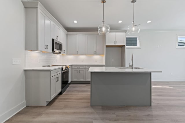 5509 Urbandale Ave, Nashville, TN 37209 - kitchen with a sink, electric range, baseboards, stainless steel microwave, and recessed lighting
