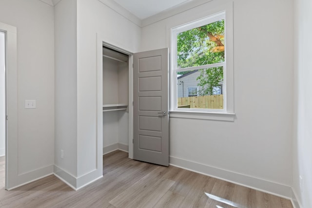 5509 Urbandale Ave, Nashville, TN 37209 - unfurnished bedroom featuring light wood-style flooring, a closet, and baseboards