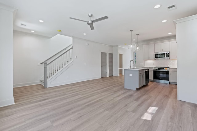 5509 Urbandale Ave, Nashville, TN 37209 - kitchen with stainless steel appliances, light countertops, a ceiling fan, a sink, and recessed lighting