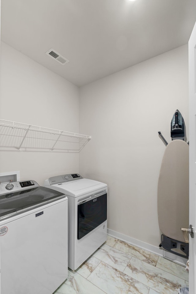 503 Gingerwood Ln, Hendersonville, TN 37075 - laundry room featuring washer and clothes dryer, light marble finish floors, and baseboards