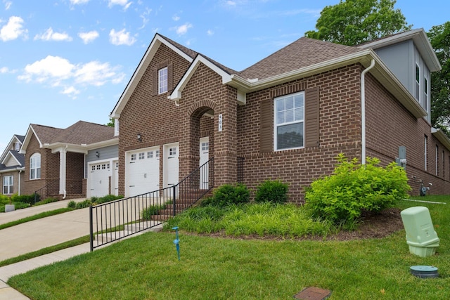 503 Gingerwood Ln, Hendersonville, TN 37075 - view of front of house with brick siding, driveway, a front lawn, and a garage