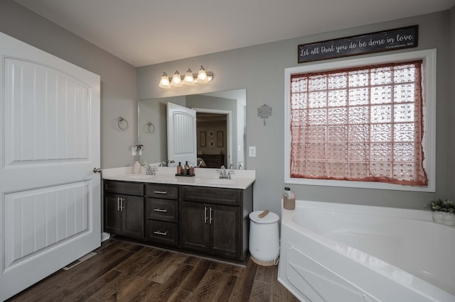 4526 Culpepper Cir, Murfreesboro, TN 37129 - bathroom with double vanity, a bath, and wood finished floors