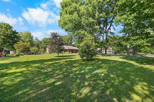 346 Lynnford Dr, Murfreesboro, TN 37128 - view of grassy yard featuring view of wooded area