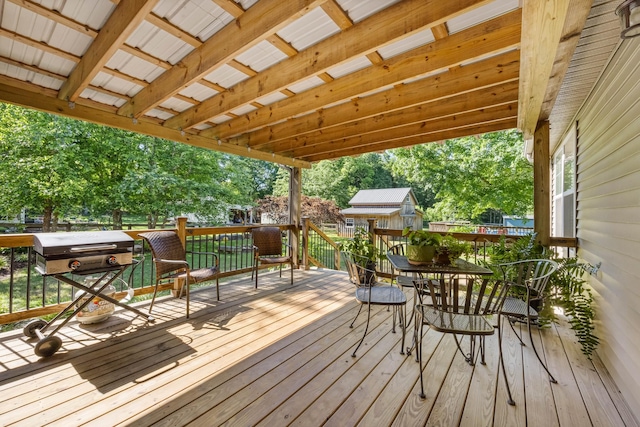 346 Lynnford Dr, Murfreesboro, TN 37128 - deck featuring outdoor dining space, view of wooded area, an outdoor structure, and area for grilling