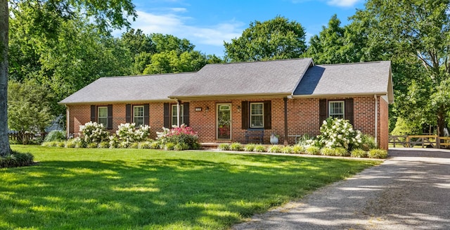 346 Lynnford Dr, Murfreesboro, TN 37128 - view of front of property with brick siding, a front lawn, and roof with shingles