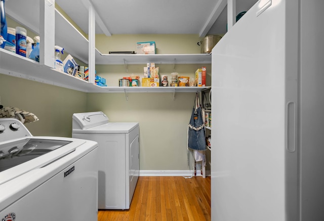 346 Lynnford Dr, Murfreesboro, TN 37128 - laundry area with washing machine and clothes dryer, light wood-style floors, and baseboards