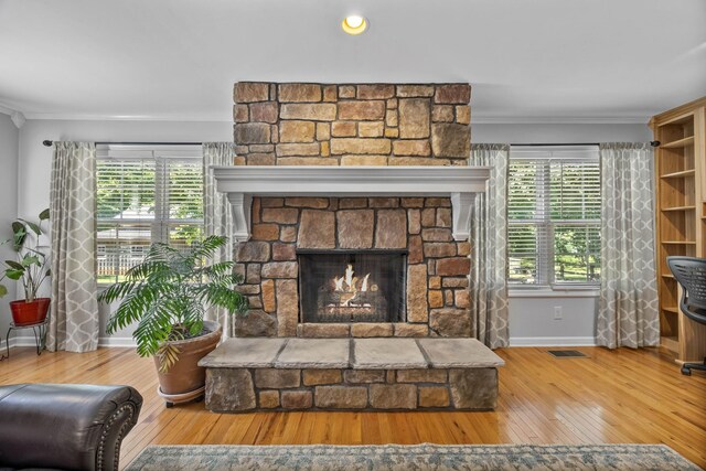 346 Lynnford Dr, Murfreesboro, TN 37128 - detailed view of wood finished floors, baseboards, a stone fireplace, and ornamental molding