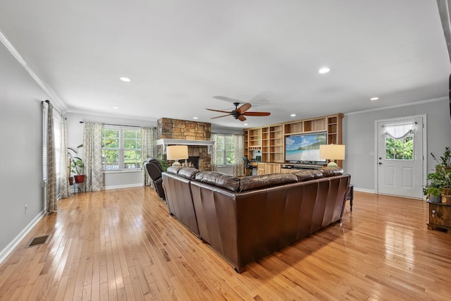 346 Lynnford Dr, Murfreesboro, TN 37128 - living room featuring a ceiling fan, baseboards, ornamental molding, a fireplace, and light wood-style flooring
