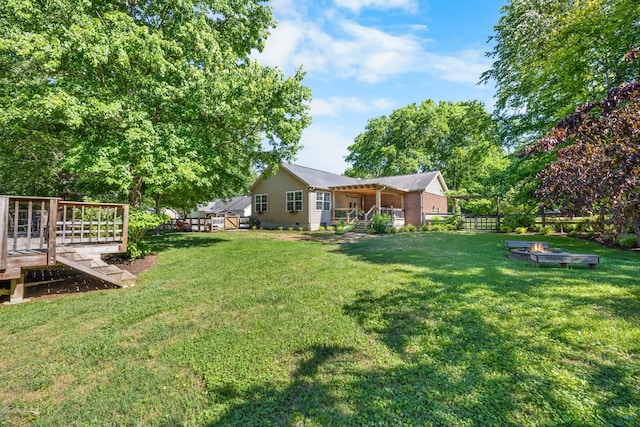 346 Lynnford Dr, Murfreesboro, TN 37128 - view of yard with an outdoor fire pit and a deck