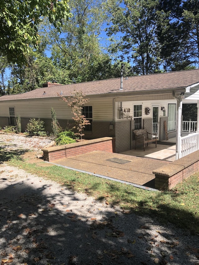 470 Askin Ln, Baxter, TN 38544 - rear view of house with brick siding, a patio area, and a shingled roof