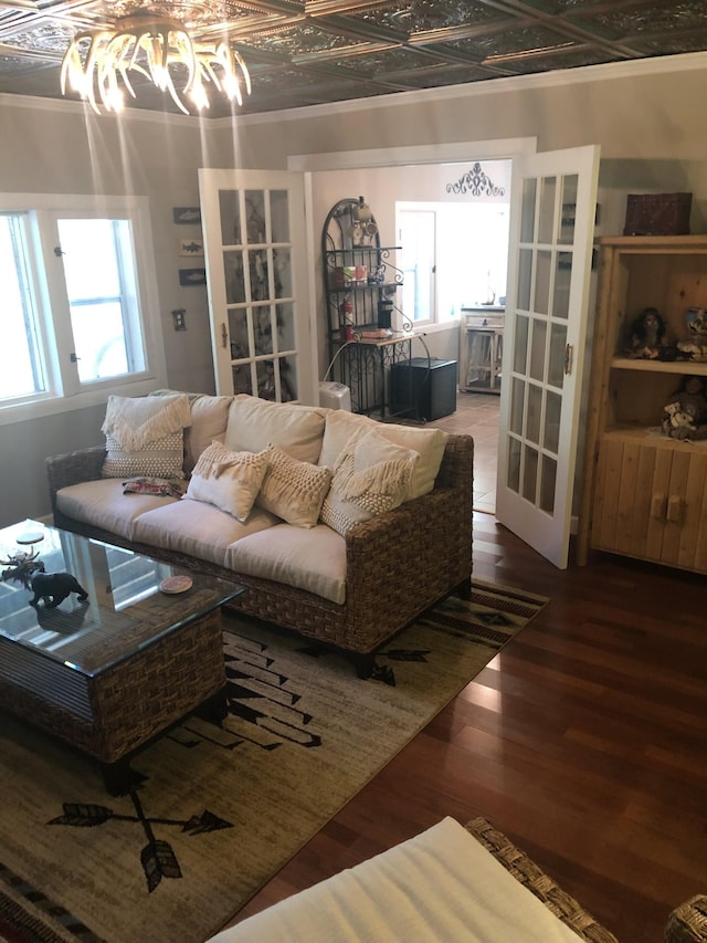 470 Askin Ln, Baxter, TN 38544 - living room with french doors, wood finished floors, an ornate ceiling, a chandelier, and crown molding