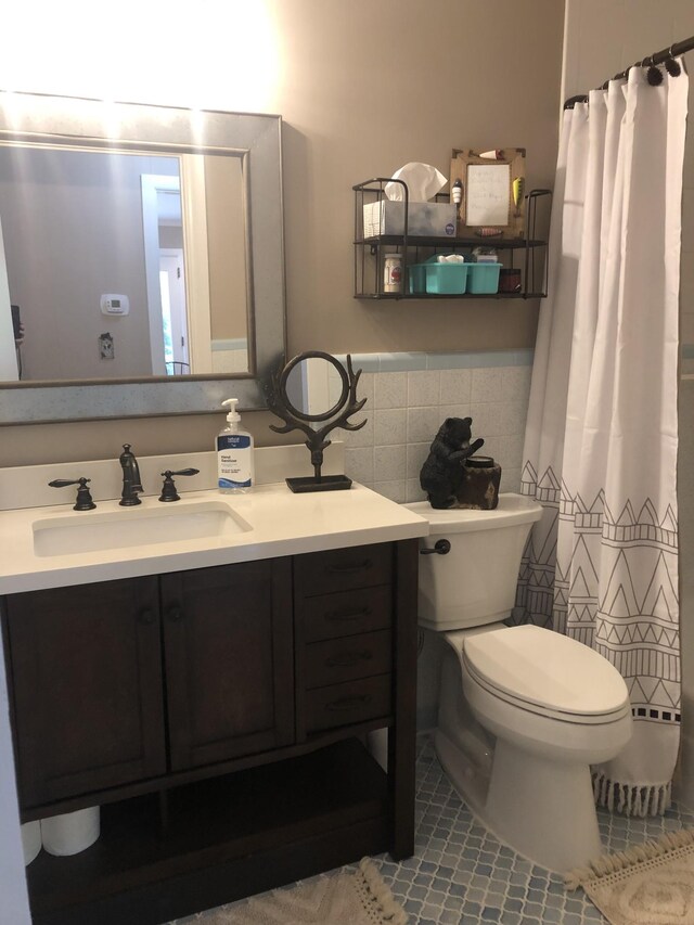 470 Askin Ln, Baxter, TN 38544 - bathroom featuring vanity, a baseboard heating unit, toilet, tile patterned flooring, and tile walls