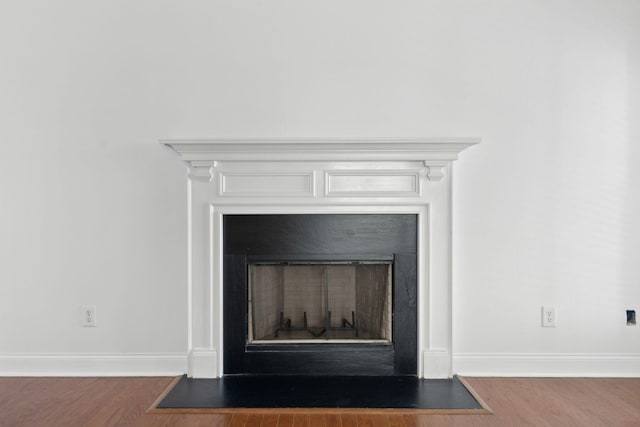 3511 Blaze Dr, Murfreesboro, TN 37128 - detailed view of a fireplace with flush hearth, wood finished floors, and baseboards