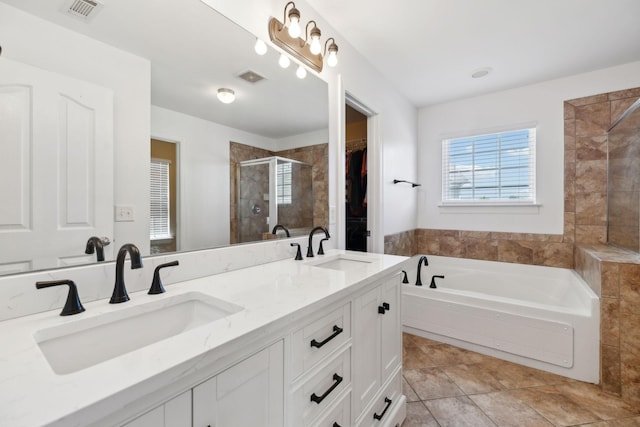 3511 Blaze Dr, Murfreesboro, TN 37128 - full bath featuring a shower stall, double vanity, a bath, tile patterned floors, and a spacious closet
