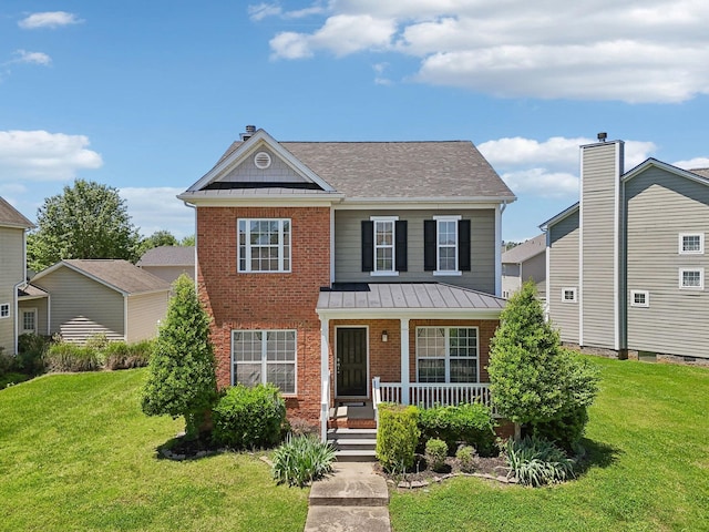3511 Blaze Dr, Murfreesboro, TN 37128 - view of front of house with covered porch, brick siding, a front yard, and roof with shingles