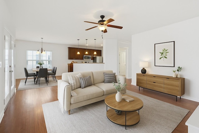 3511 Blaze Dr, Murfreesboro, TN 37128 - living room with a ceiling fan, wood finished floors, and baseboards