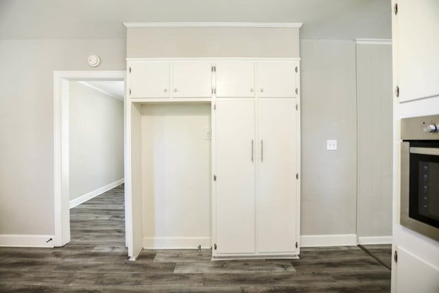 1625 Shady Cir, Lebanon, TN 37087 - kitchen featuring white cabinetry, dark wood-style flooring, ornamental molding, baseboards, and stainless steel oven