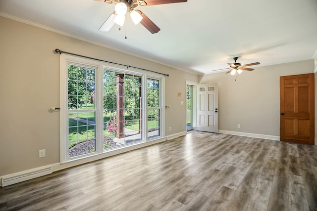 1625 Shady Cir, Lebanon, TN 37087 - unfurnished room featuring a ceiling fan, a baseboard heating unit, ornamental molding, wood finished floors, and baseboards