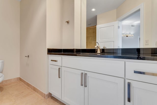 110 31st Ave N Unit 301, Nashville, TN 37203 - full bath featuring toilet, vanity, baseboards, tile patterned floors, and a shower