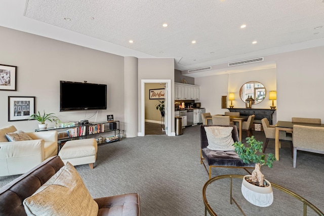 110 31st Ave N Unit 301, Nashville, TN 37203 - living room with carpet floors, recessed lighting, and a textured ceiling