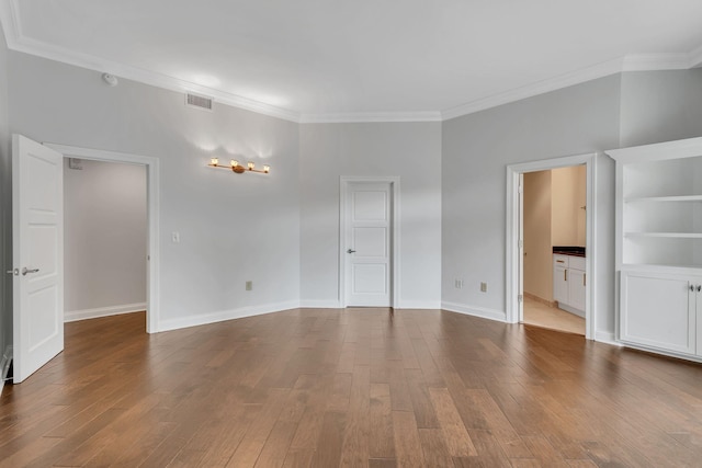 110 31st Ave N Unit 301, Nashville, TN 37203 - empty room featuring ornamental molding, wood finished floors, and baseboards