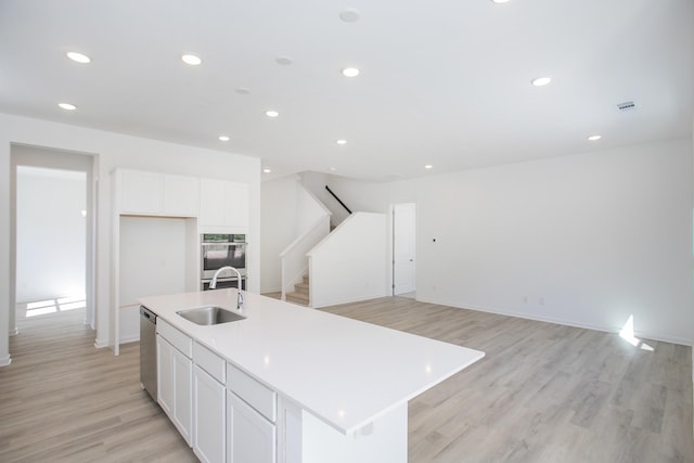 3044 Fernwood Ln, Columbia, TN 38401 - kitchen featuring a sink, light wood-type flooring, white cabinetry, appliances with stainless steel finishes, and recessed lighting