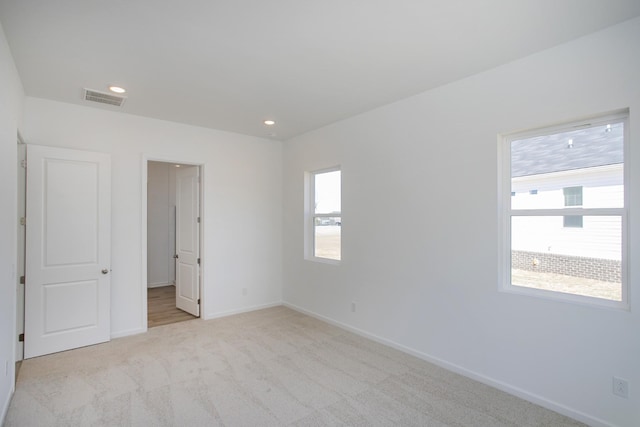 3044 Fernwood Ln, Columbia, TN 38401 - unfurnished bedroom featuring light colored carpet, baseboards, and recessed lighting