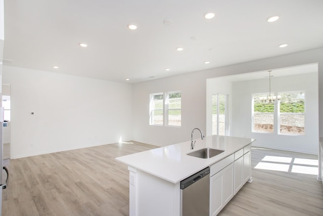 3044 Fernwood Ln, Columbia, TN 38401 - kitchen with stainless steel dishwasher, a sink, a chandelier, a kitchen island with sink, and light wood-style floors