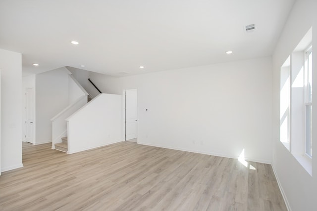 3044 Fernwood Ln, Columbia, TN 38401 - unfurnished living room featuring light wood finished floors, stairs, baseboards, and recessed lighting