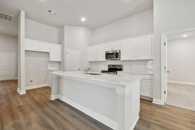 126 Cades Blf, Lebanon, TN 37087 - kitchen with stainless steel appliances, a sink, white cabinetry, a center island with sink, and recessed lighting
