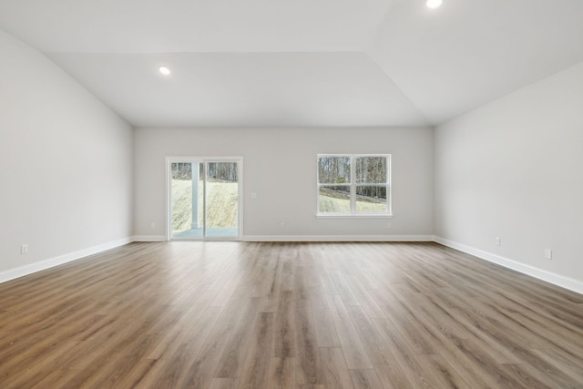 126 Cades Blf, Lebanon, TN 37087 - spare room featuring plenty of natural light, lofted ceiling, wood finished floors, recessed lighting, and baseboards