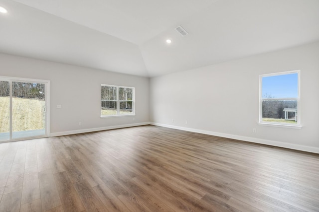 126 Cades Blf, Lebanon, TN 37087 - spare room with wood finished floors, vaulted ceiling, baseboards, and recessed lighting