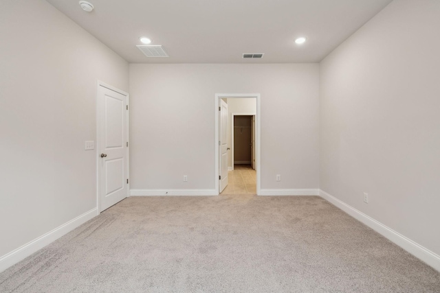126 Cades Blf, Lebanon, TN 37087 - spare room with light colored carpet, baseboards, a smoke detector, and recessed lighting