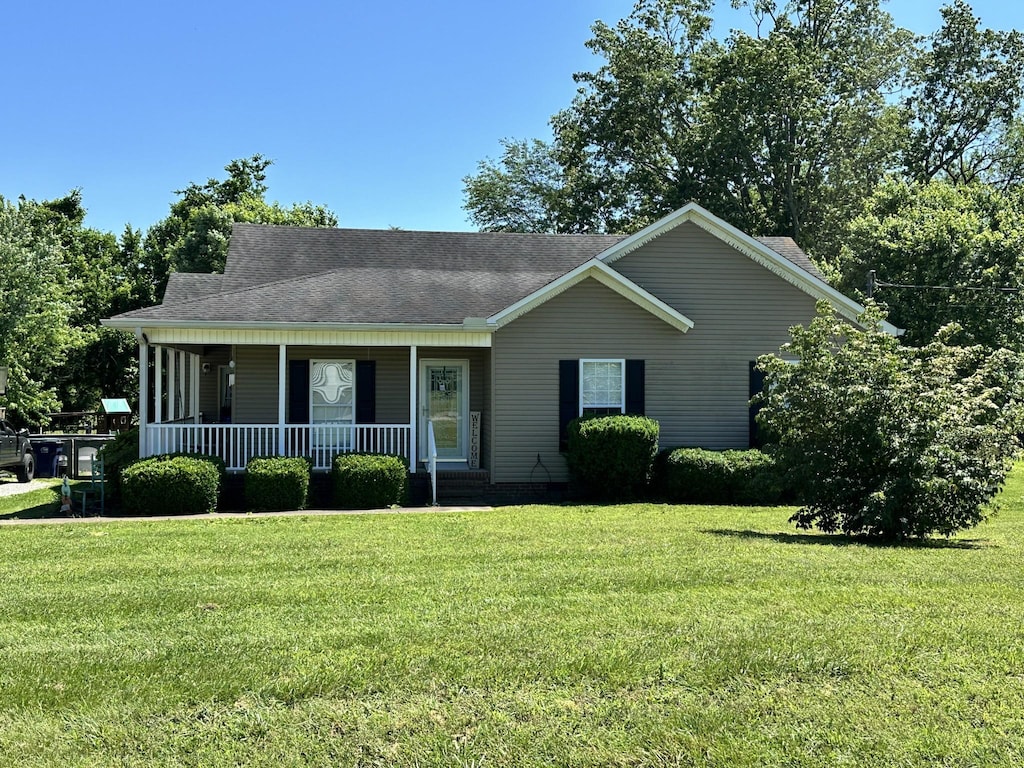 301 Maplewood Dr, Cornersville, TN 37047 - view of front of house with a porch, a front yard, and a shingled roof