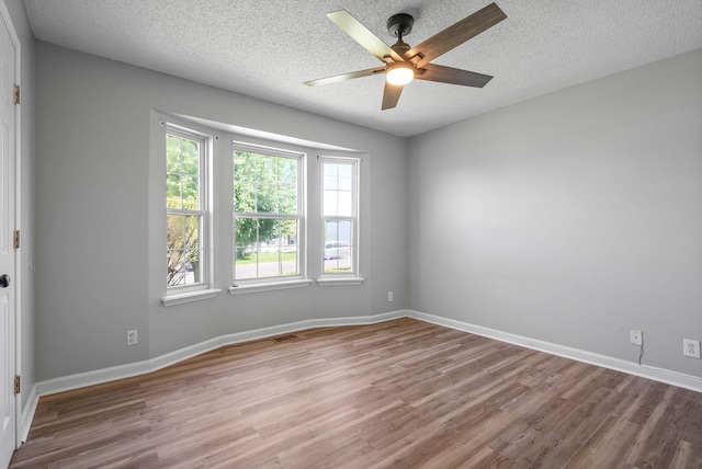 337 Atlantic Ave, Oak Grove, KY 42262 - spare room with wood finished floors, ceiling fan, a textured ceiling, and baseboards