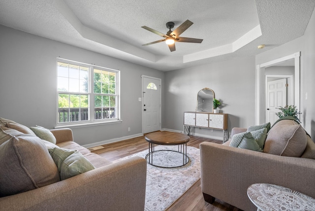 337 Atlantic Ave, Oak Grove, KY 42262 - living room with a raised ceiling, a textured ceiling, a ceiling fan, wood finished floors, and baseboards