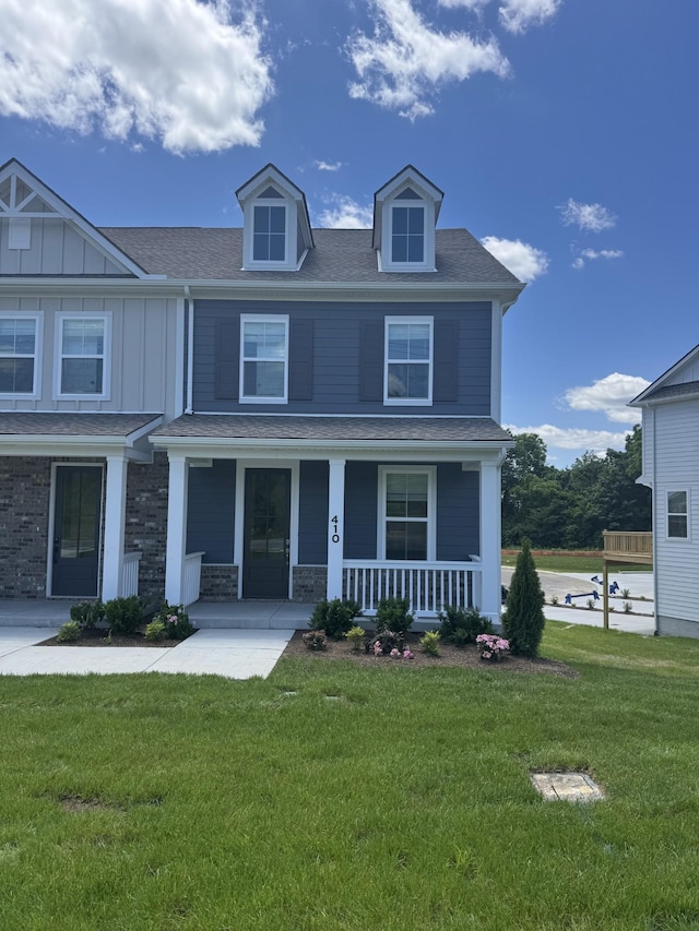 410 Blair Rd, Smyrna, TN 37167 - view of front of property with covered porch, a front lawn, roof with shingles, and board and batten siding